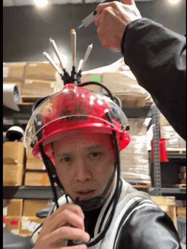 Person wearing a RAW Fireblazer Helmet with multiple cone holders, ready for a fun smoking session.