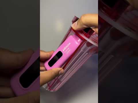 Ploox X Party Shisha Cup in hand, showcasing its sleek, portable design and modern features for smokers.