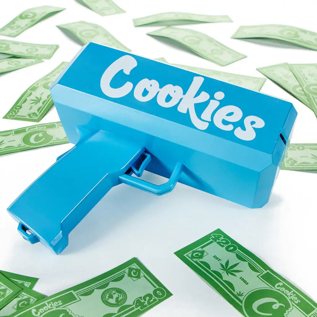 Cookies Rain Maker Money Dispenser in blue, surrounded by faux cash bills on a white background.